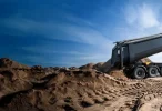 dump-truck-process-dumping-sand-600nw-2590078041-1-e1756770099348.webp